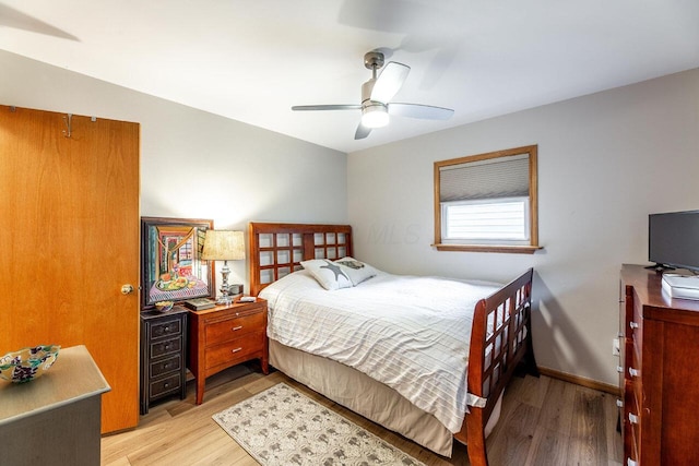 bedroom featuring light wood-type flooring and ceiling fan