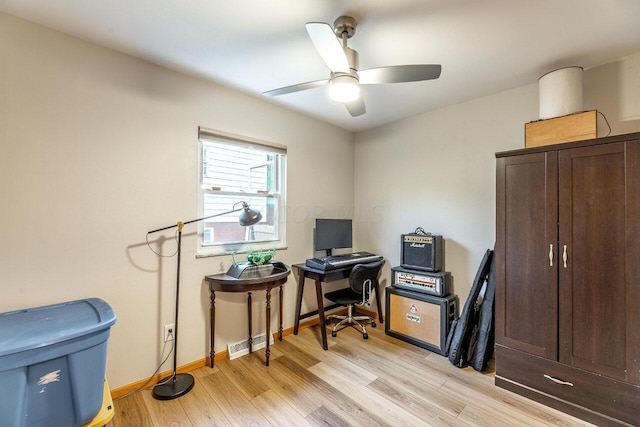 office area with light hardwood / wood-style flooring and ceiling fan