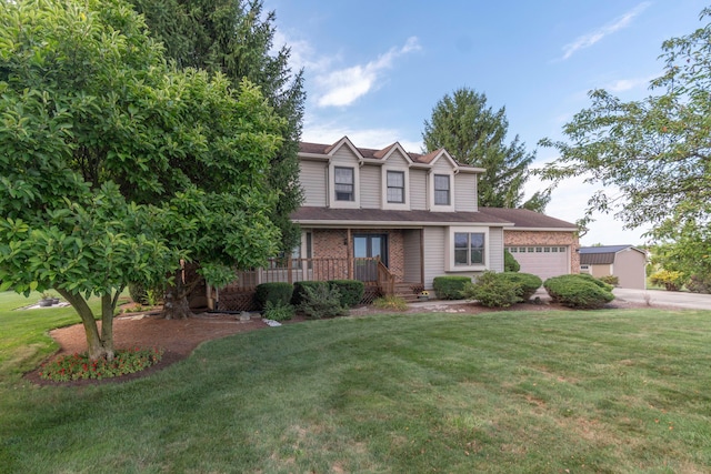 view of front of home featuring a garage and a front lawn