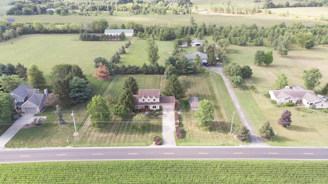 birds eye view of property with a rural view