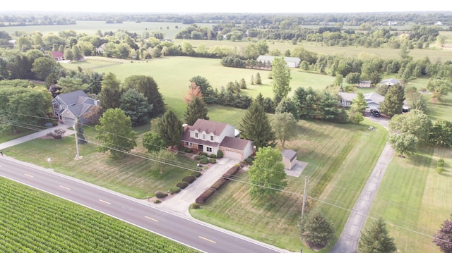 birds eye view of property with a rural view