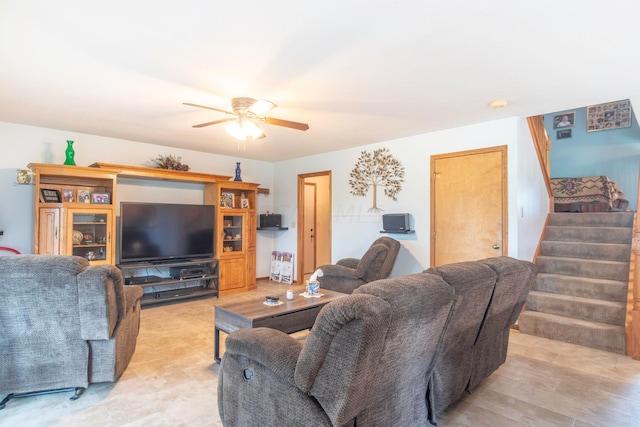 living room featuring ceiling fan and light wood-type flooring