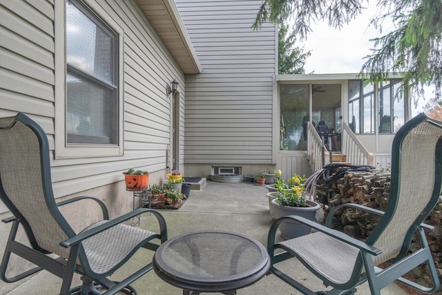 view of patio with a sunroom