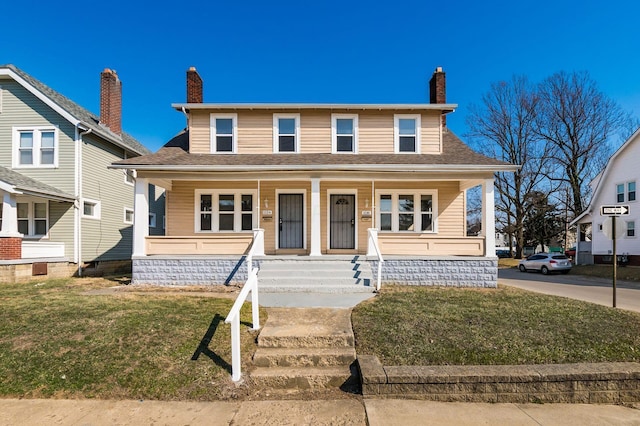 bungalow-style home featuring a front yard, a porch, a chimney, and roof with shingles