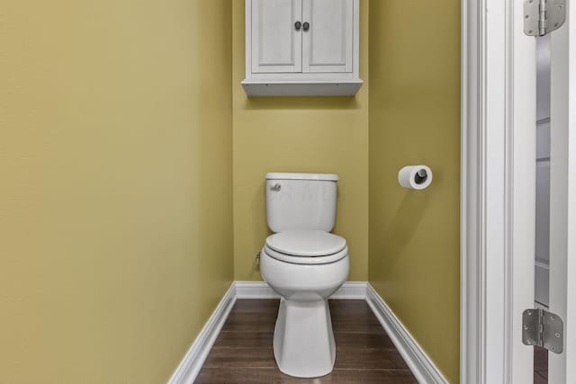 bathroom featuring hardwood / wood-style floors and toilet