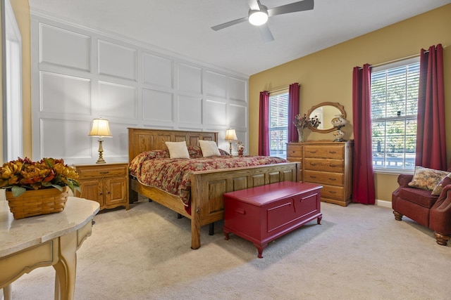 bedroom with light colored carpet and ceiling fan