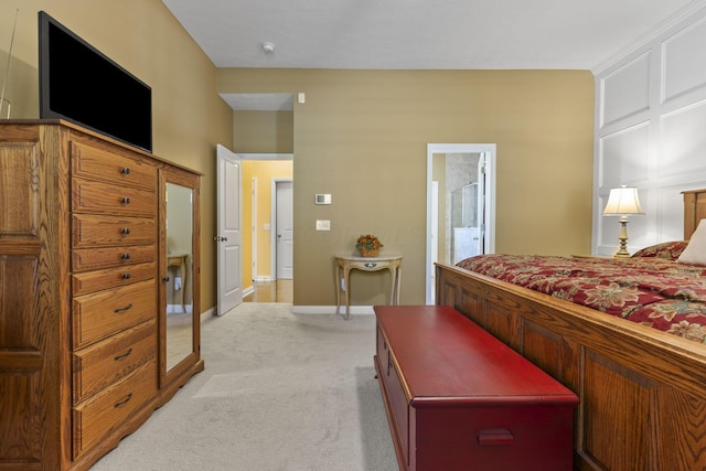 carpeted bedroom featuring connected bathroom