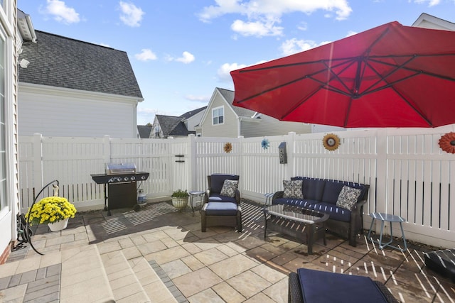 view of patio / terrace with outdoor lounge area and a grill