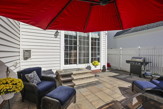 view of patio featuring a grill