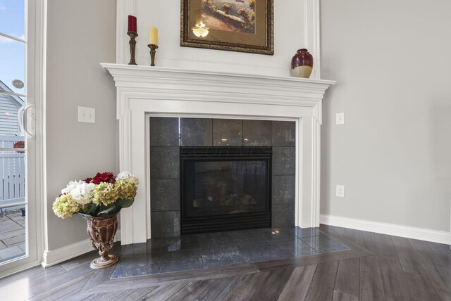 interior details with a fireplace and hardwood / wood-style flooring