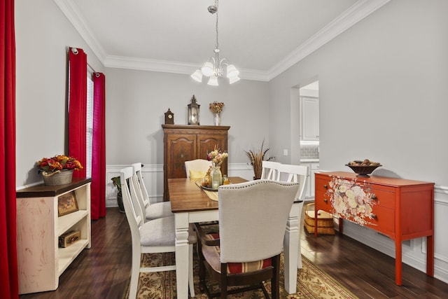 dining space with a chandelier, dark hardwood / wood-style floors, and ornamental molding