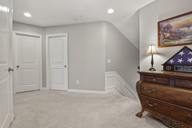 carpeted bedroom featuring lofted ceiling