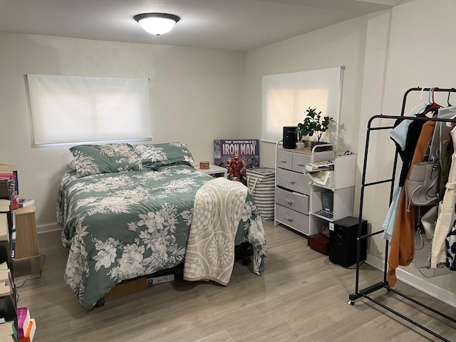 bedroom with light hardwood / wood-style floors