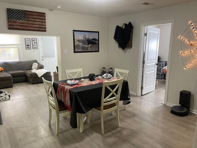 dining area with light hardwood / wood-style flooring