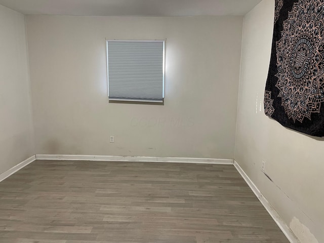 spare room featuring hardwood / wood-style floors