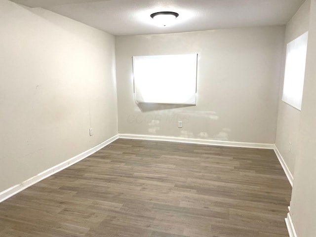 spare room featuring dark hardwood / wood-style floors