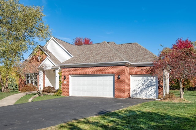 view of front property with a front yard and a garage