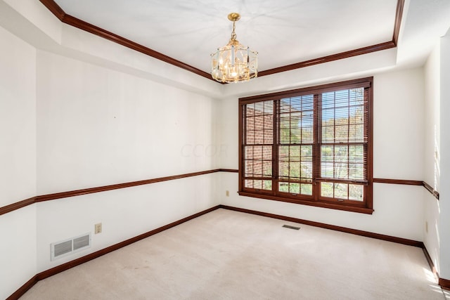 carpeted empty room featuring crown molding, a wealth of natural light, and a notable chandelier