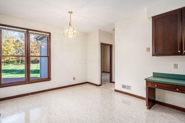 interior space featuring a chandelier