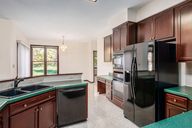 kitchen featuring pendant lighting, a notable chandelier, black appliances, sink, and dark brown cabinets