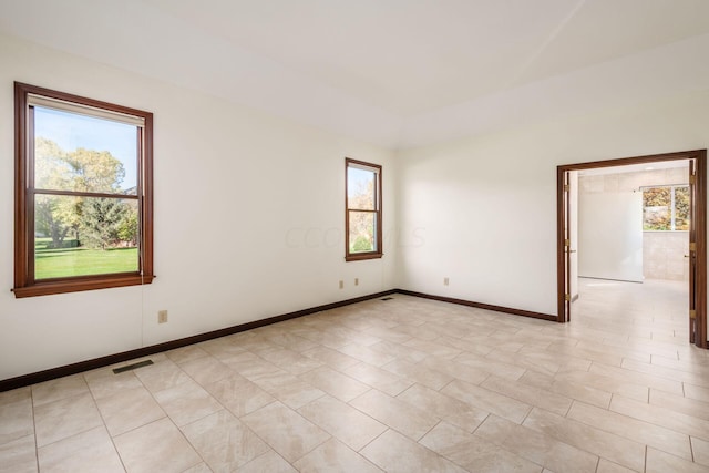 unfurnished room featuring a wealth of natural light