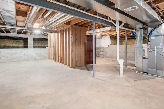 basement featuring heating unit