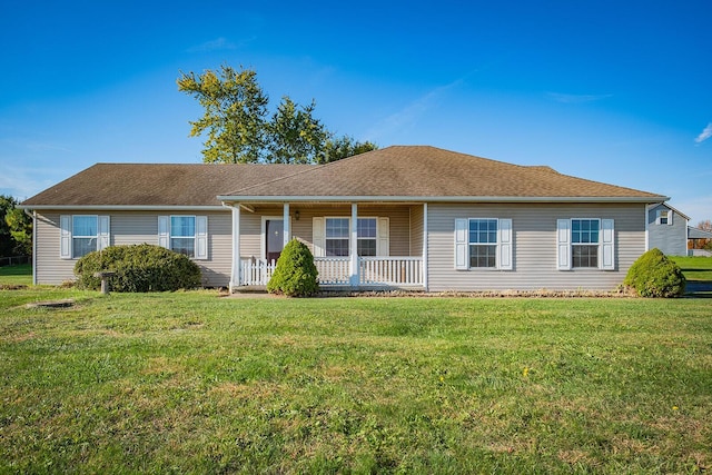 single story home with a porch and a front lawn