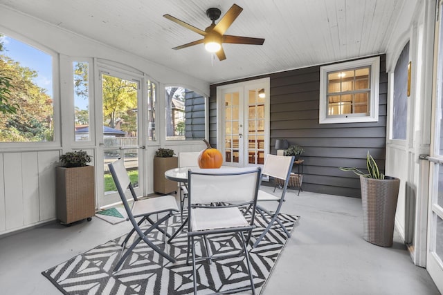 sunroom / solarium with ceiling fan and a healthy amount of sunlight