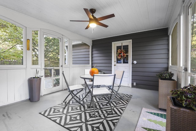 sunroom featuring a wealth of natural light and ceiling fan