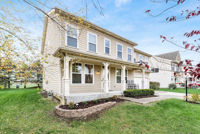 view of front of house featuring a porch, a garage, and a front lawn