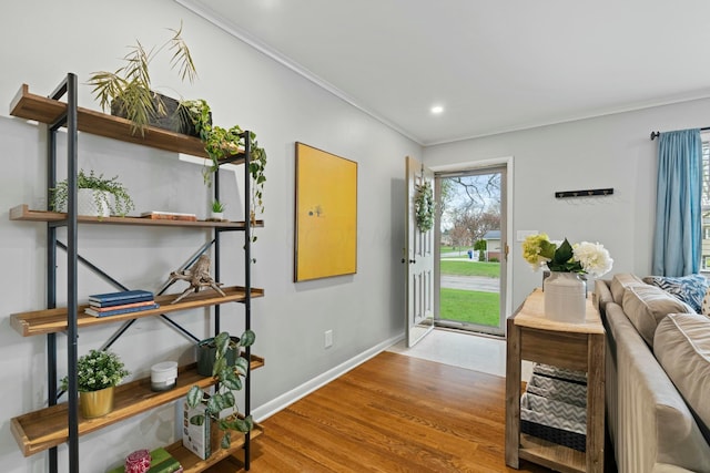 entryway with crown molding, baseboards, recessed lighting, and wood finished floors
