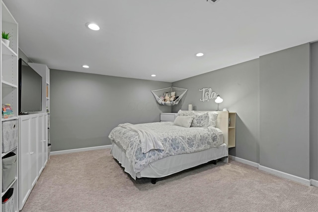bedroom with recessed lighting, light colored carpet, and baseboards