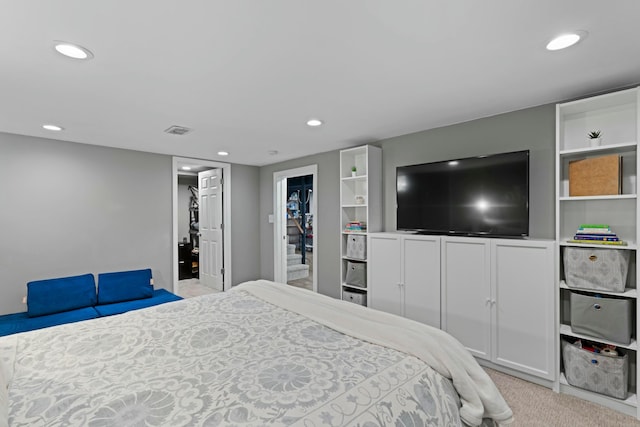 bedroom featuring recessed lighting, visible vents, and light colored carpet