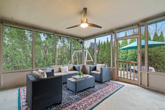 sunroom / solarium with outdoor lounge area and a ceiling fan