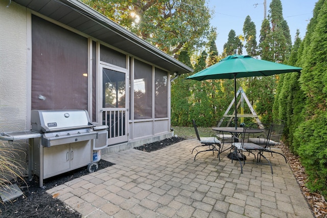 view of patio with grilling area and outdoor dining space