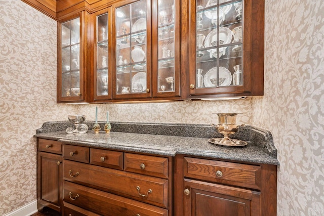 bar featuring dark stone counters