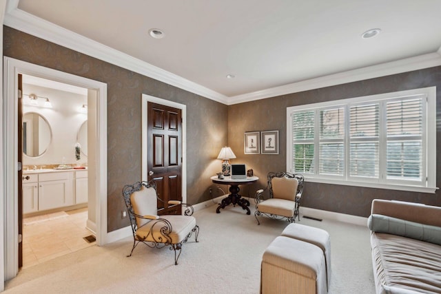 living area featuring crown molding, sink, and light colored carpet