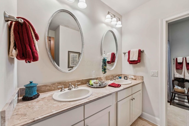 bathroom featuring tile patterned floors and vanity