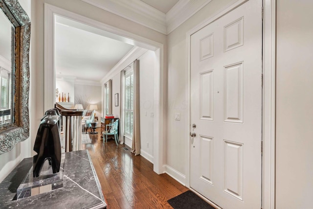 entryway featuring dark hardwood / wood-style floors and crown molding