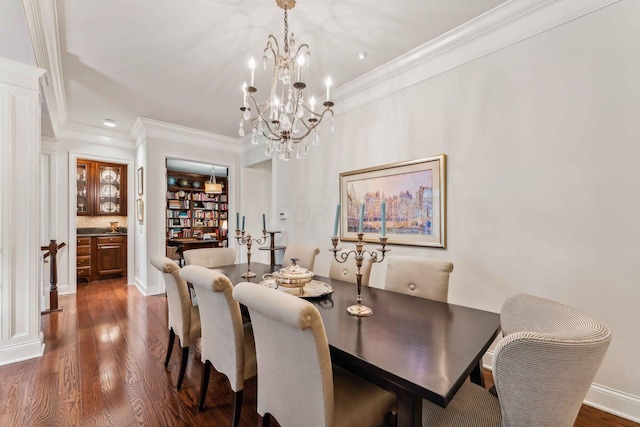 dining area with a chandelier, dark hardwood / wood-style floors, and crown molding