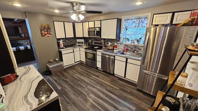 3483 State Route 257, Ostrander, OH 43061 - kitchen with white cabinets, dark hardwood / wood-style floors, sink, and appliances with stainless steel finishes
