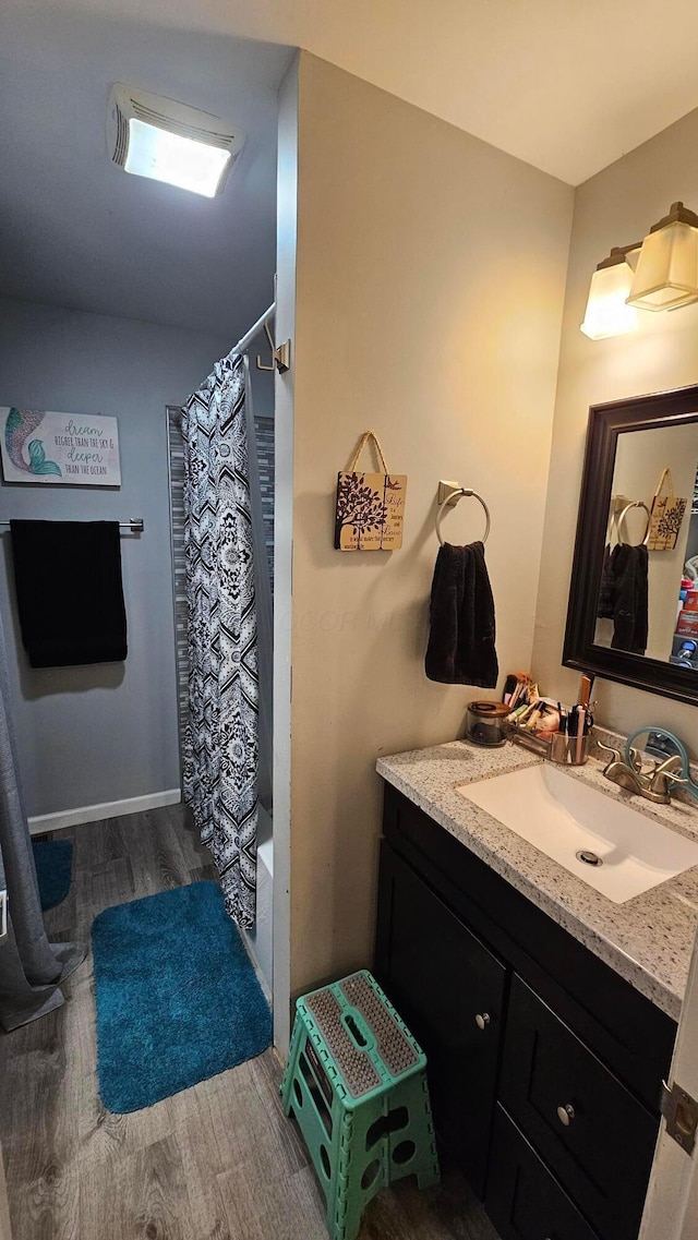 3483 State Route 257, Ostrander, OH 43061 - bathroom with hardwood / wood-style floors, vanity, and shower / tub combo with curtain