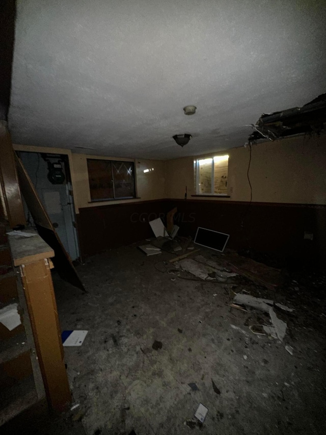 basement with a textured ceiling