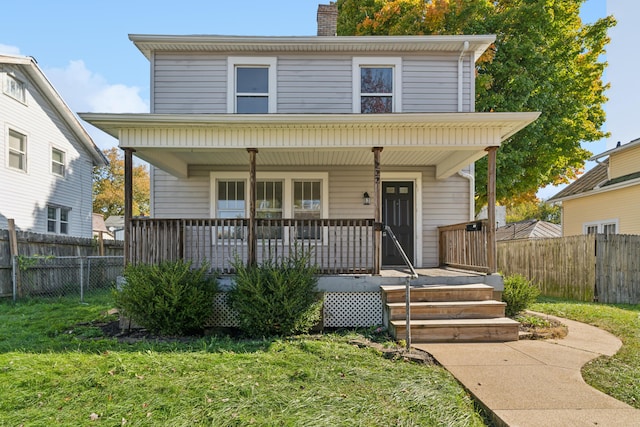 view of front property featuring a porch and a front yard