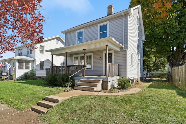 front facade with a porch and a front lawn