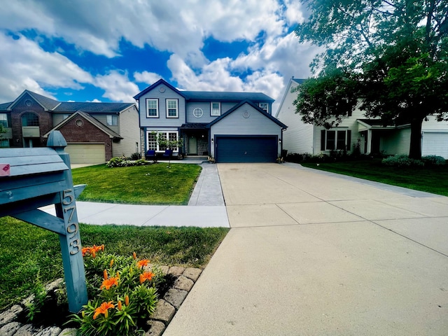 view of front of home featuring a garage and a front lawn