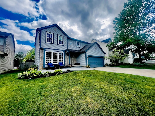 view of front of home featuring a garage and a front lawn