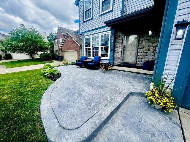 view of home's exterior with a lawn and a garage