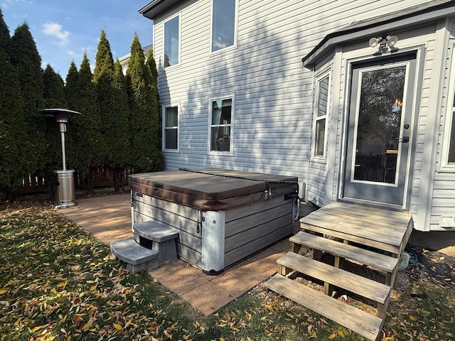 exterior space featuring a hot tub