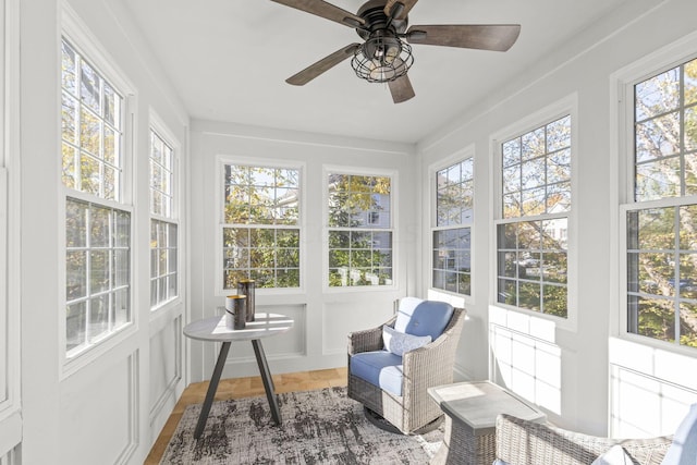 sunroom with ceiling fan and a healthy amount of sunlight